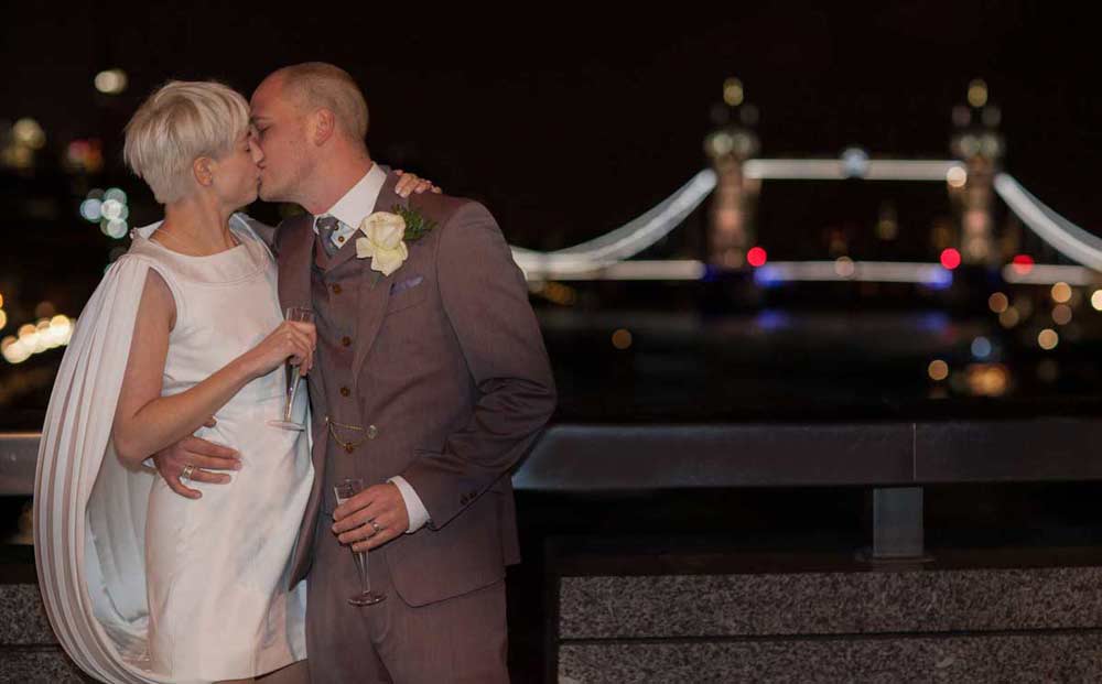 near Tower Bridge wedding kiss