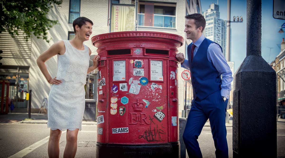 wedding laughter by red London postbox