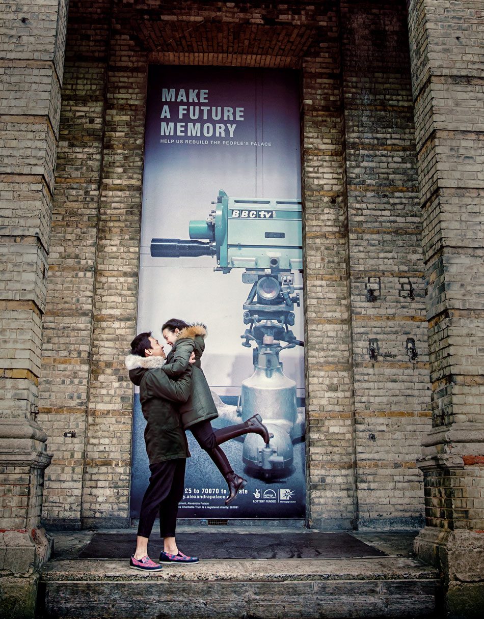 Couple jump in front of London's Alexandra Palace image