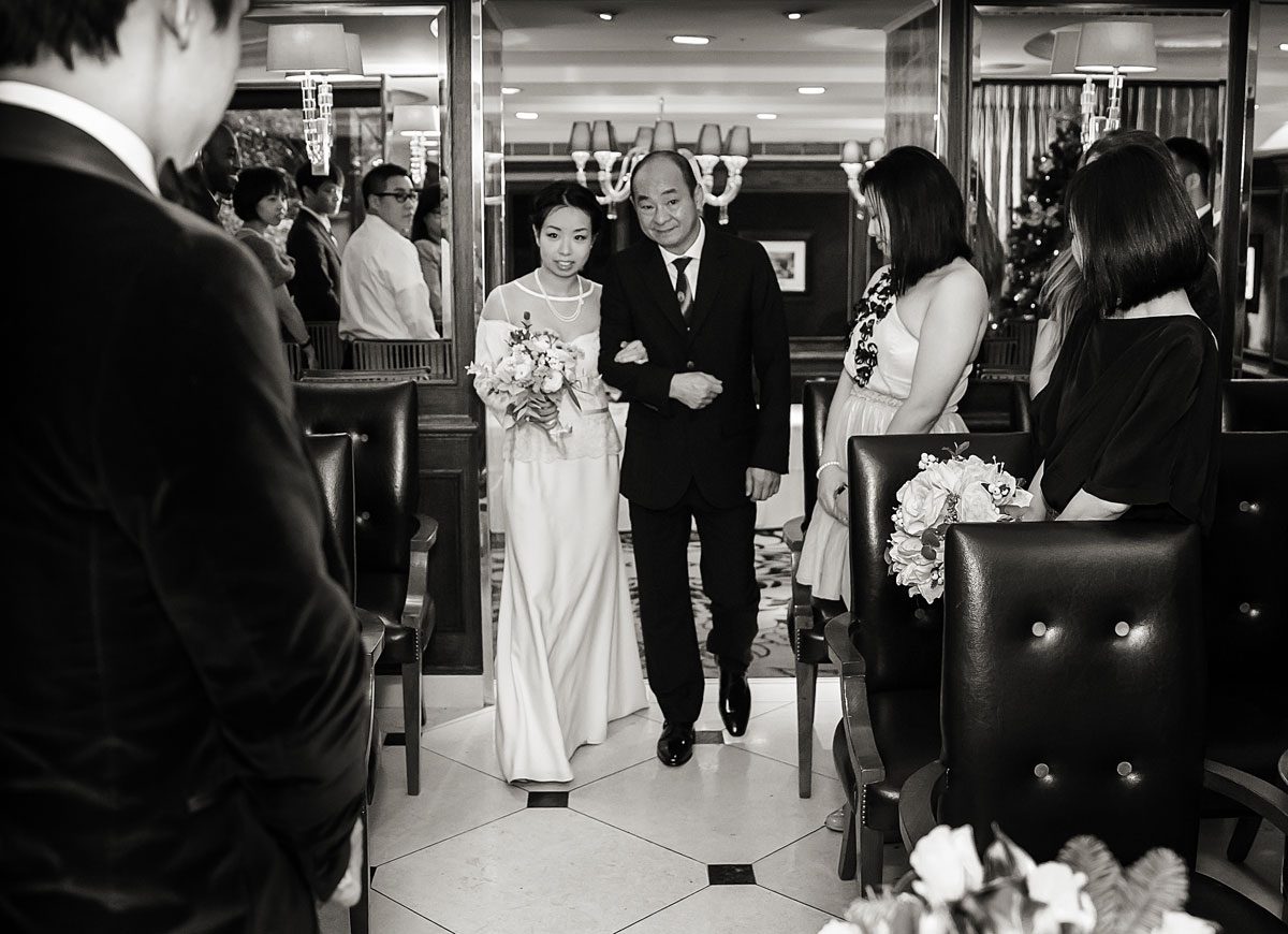 Bride down the aisle at Goring Hotel wedding ceremony