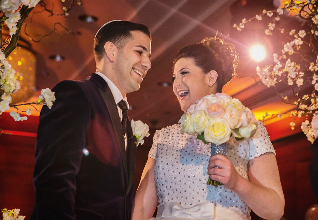 Couple laugh during wedding ceremony at Four Seasons Park Lane