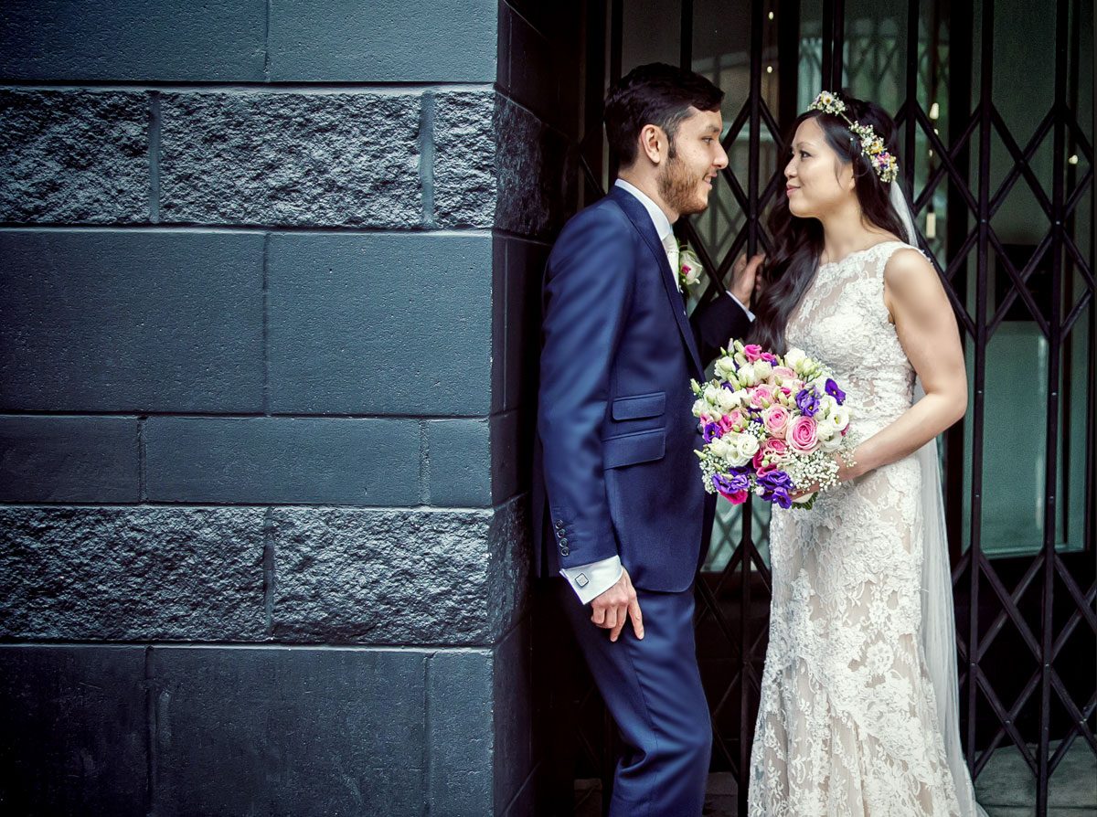 Couple look at each other on their central London wedding day