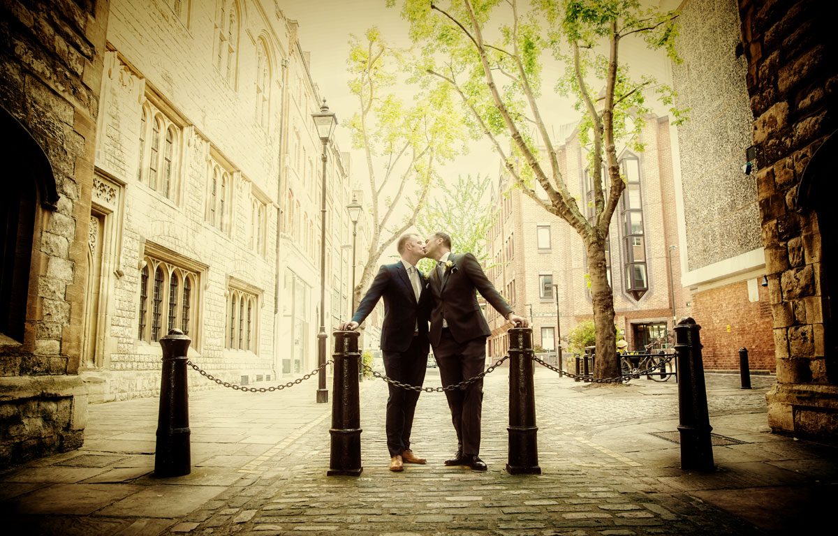 London gay wedding photographers kissing couple photo