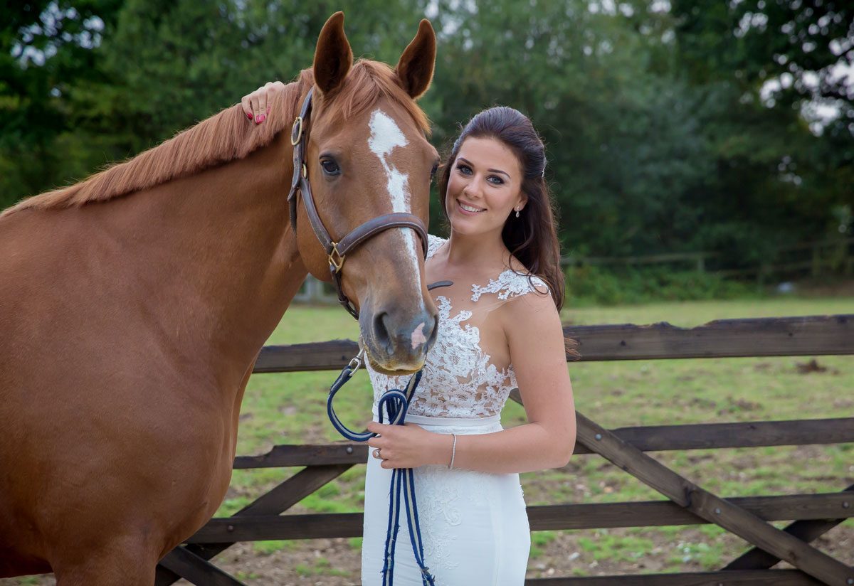 Bride with horse on London wedding day image