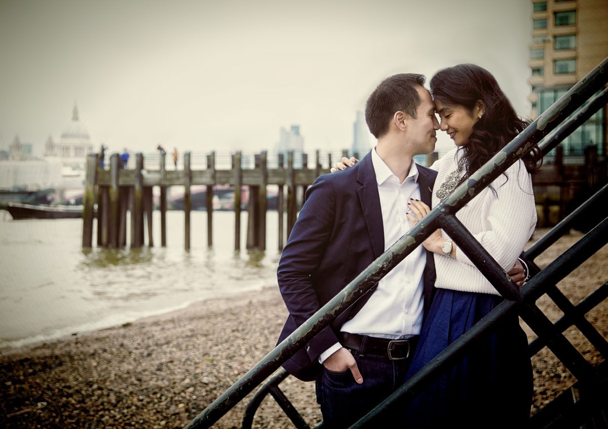 Couple on beach by Oxo Tower engagement photo shoot