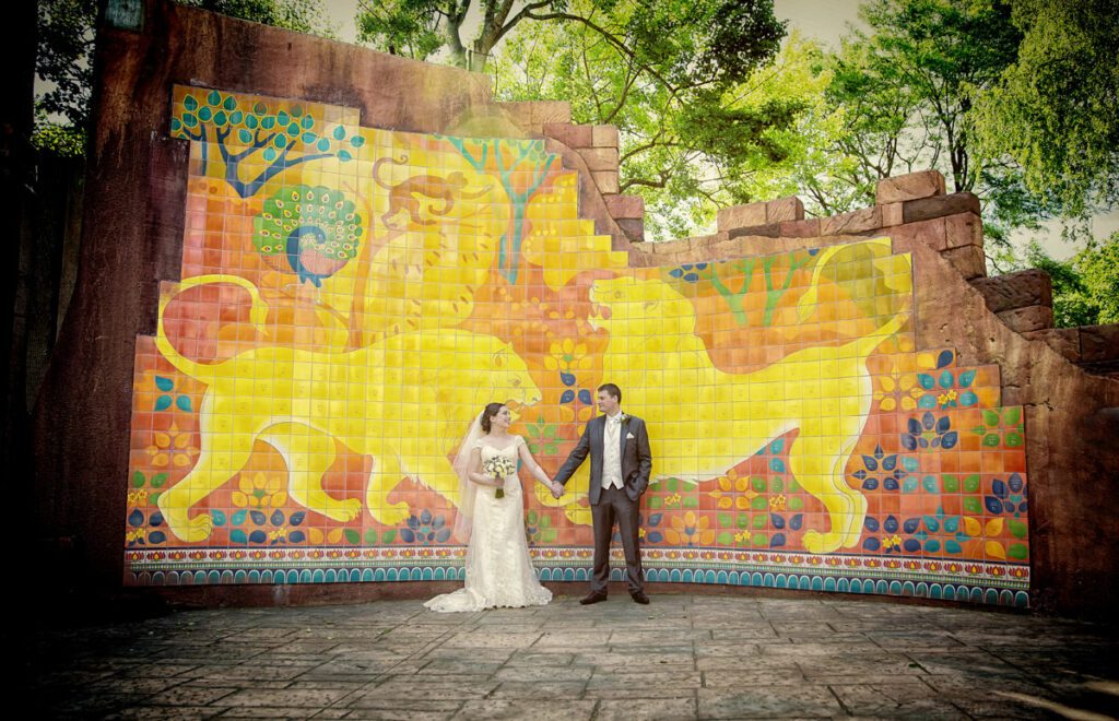 London Zoo wedding bride and groom in front of jungle mural
