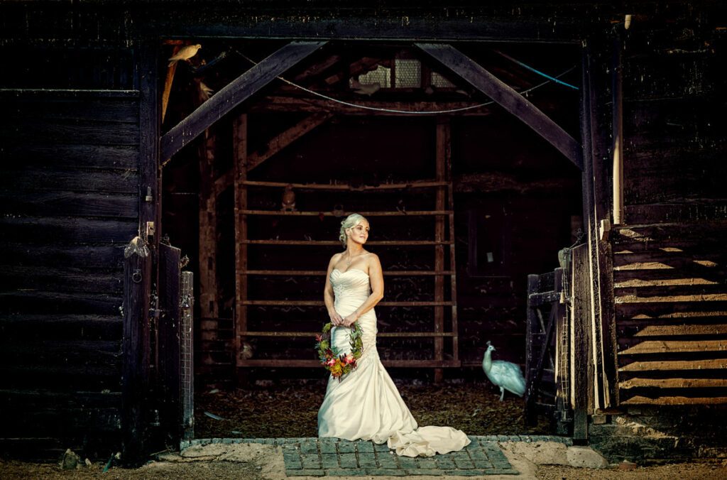 Bride in a barn at her South Farm wedding photo
