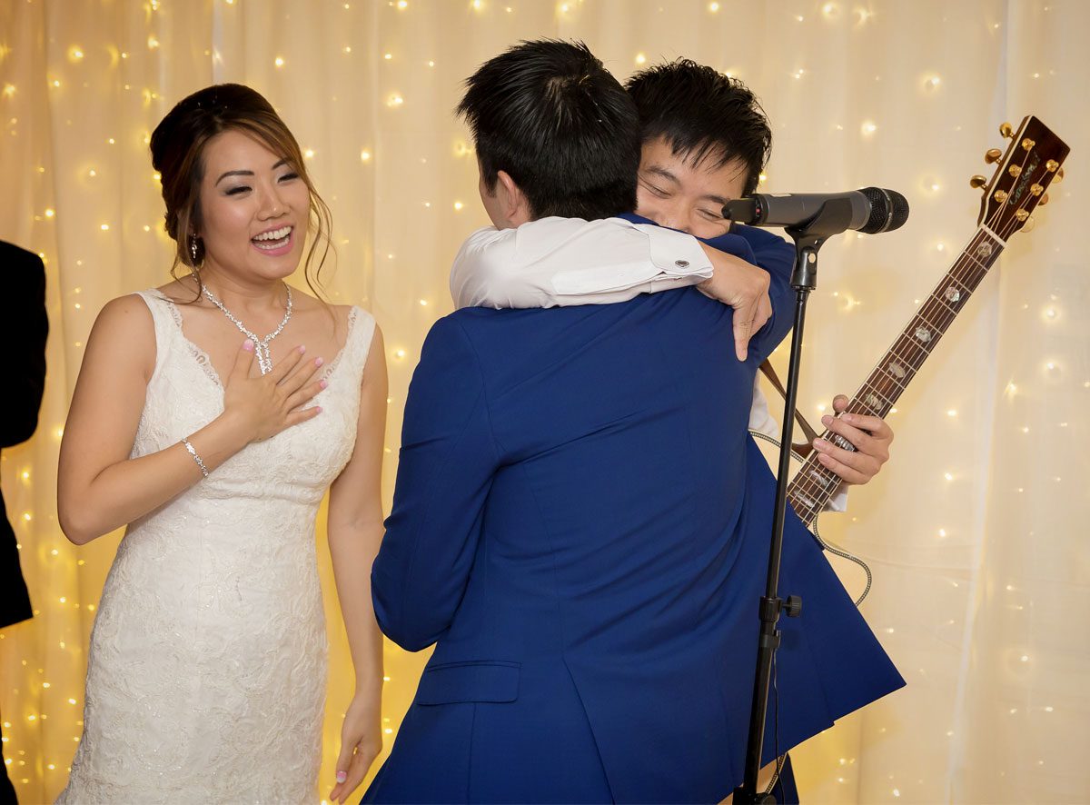 Bride groom and guitarist at Stoke Place wedding reception