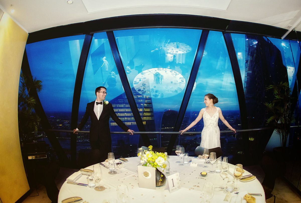Bride and groom by head table at Gherkin reception image