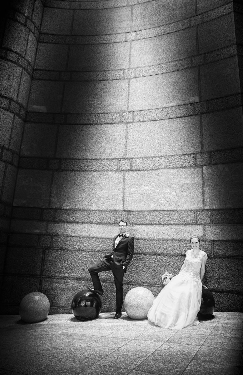 Bride and groom pose with Charing Cross architecture photo