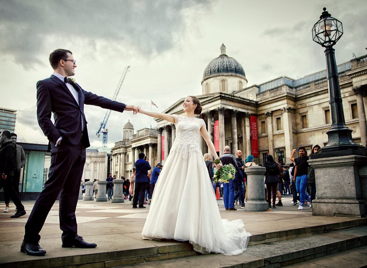 Wedding couple pose outside The National Gallery London