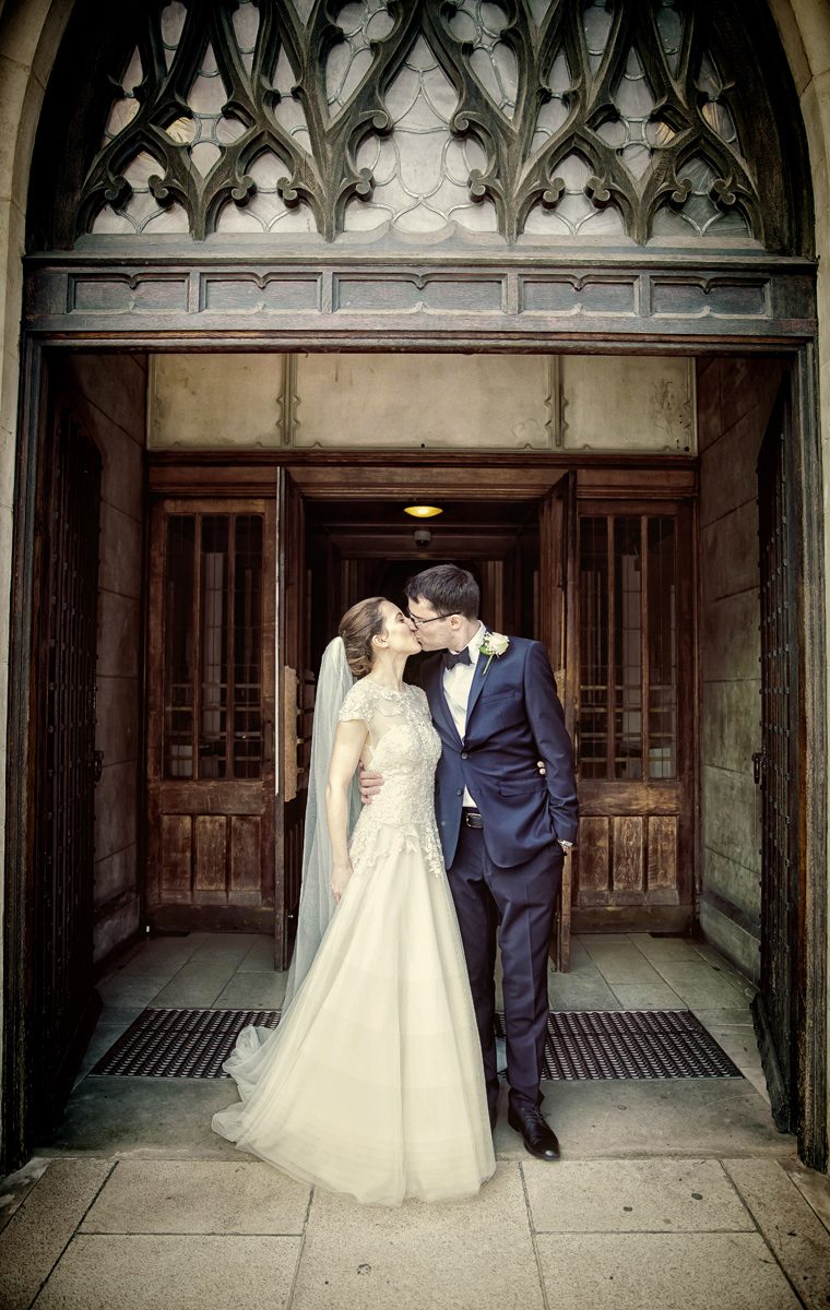 Wedding kiss at the doors of St George's Cathedral in London