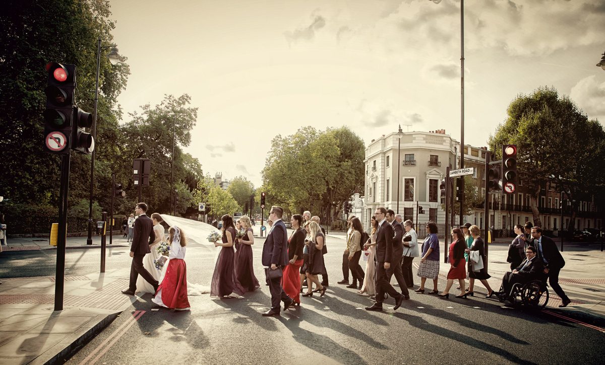 Wedding party cross London road by St George's Cathedral