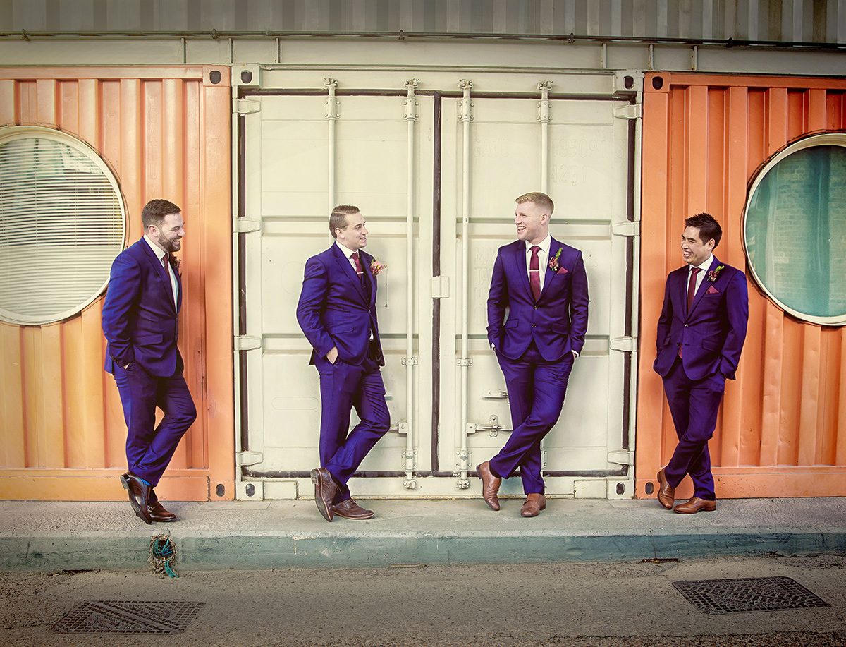 Groomsmen share a joke at Trinity Buoy Wharf wedding London