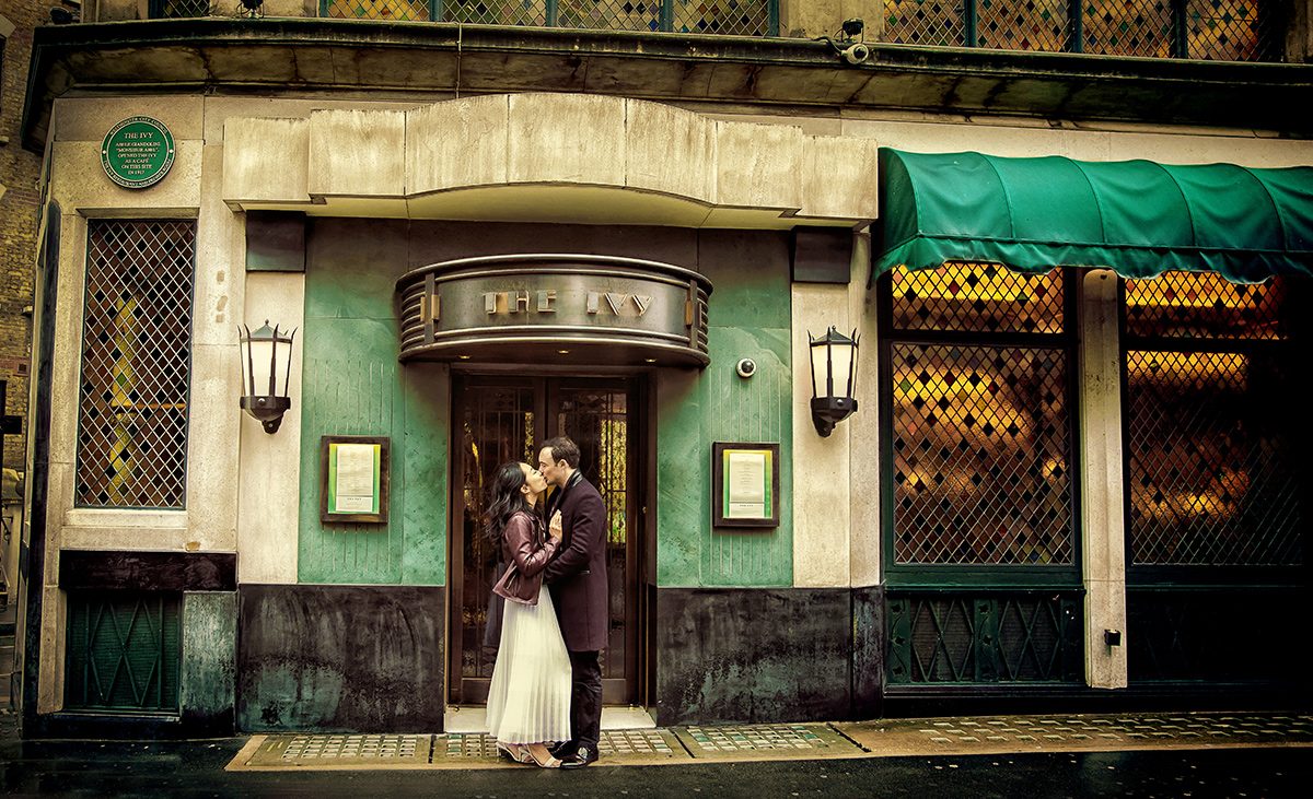 Bride and groom kiss at The Ivy London wedding
