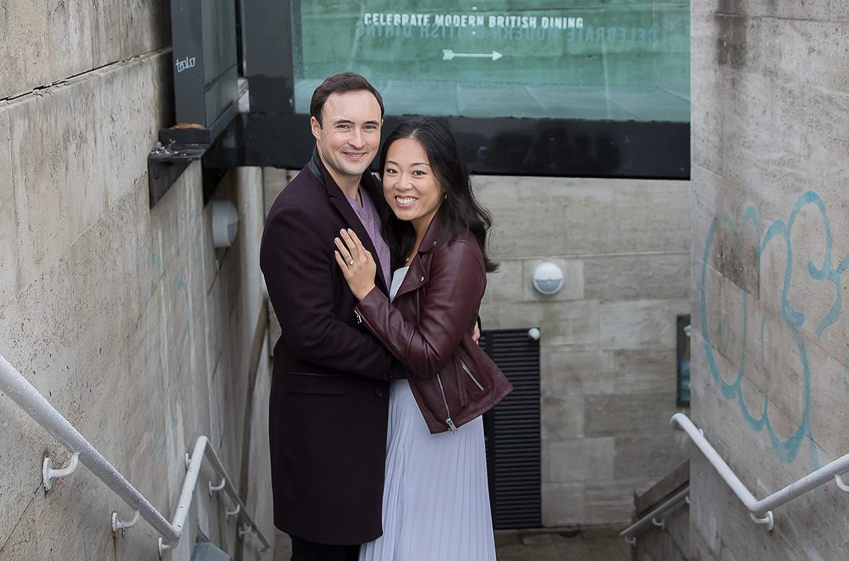 Engagement couple on London subway steps