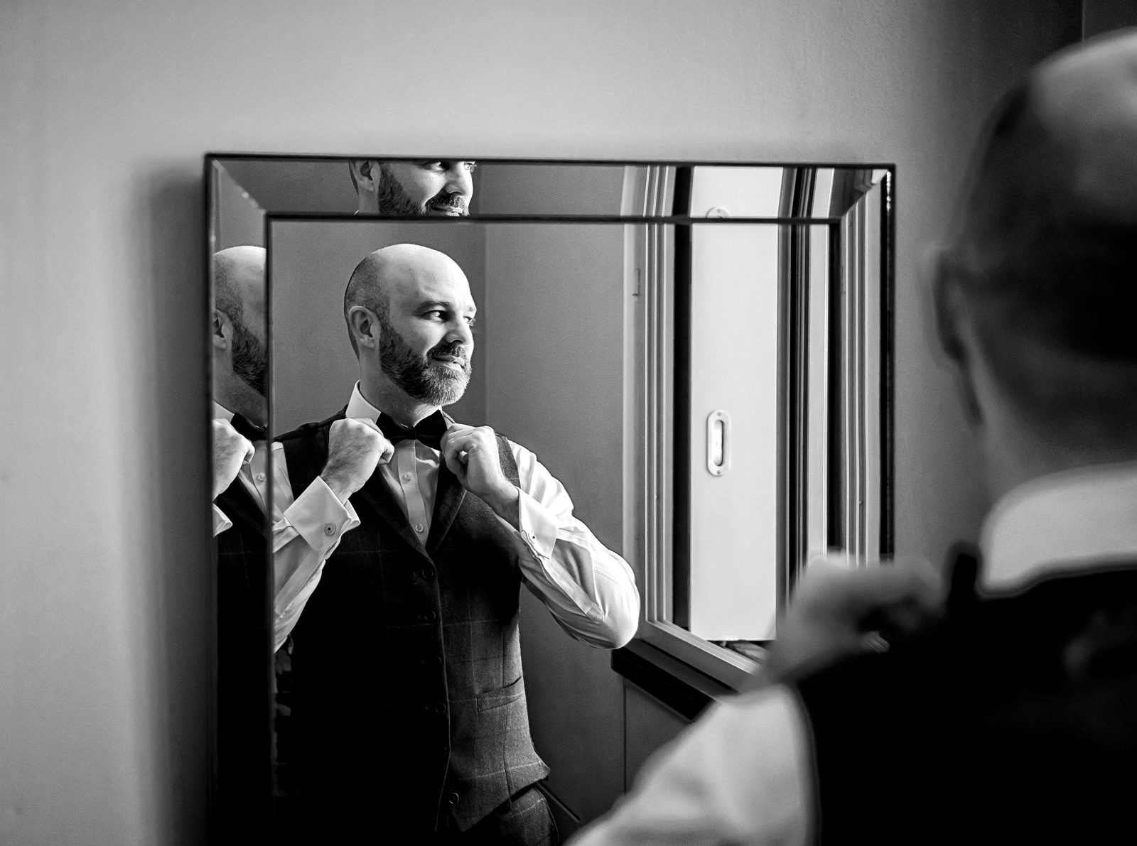 Groom in mirror Zetter Hotel wedding