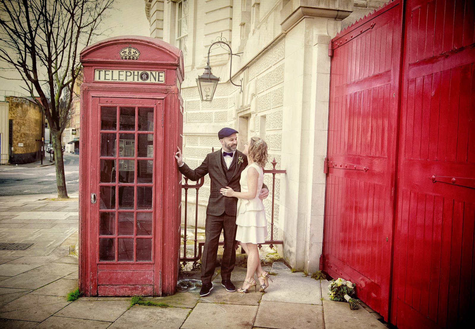 London wedding couple by red phone box Farringdon