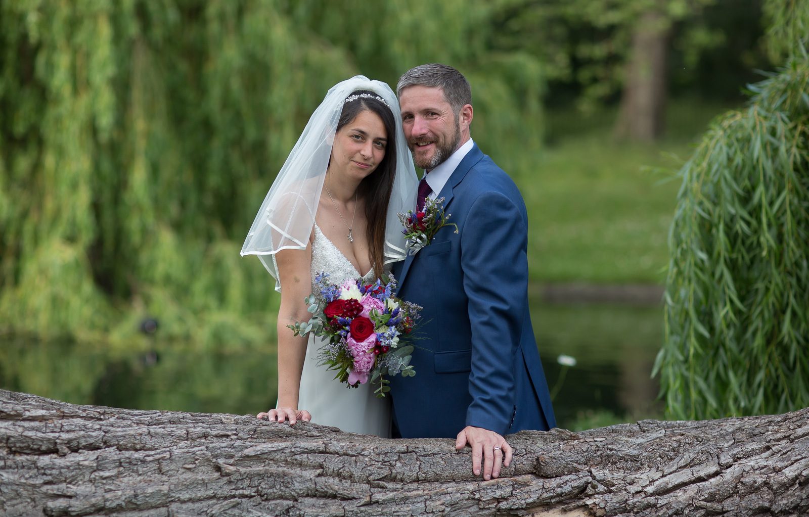 Bride and groom by log in Regents Park London