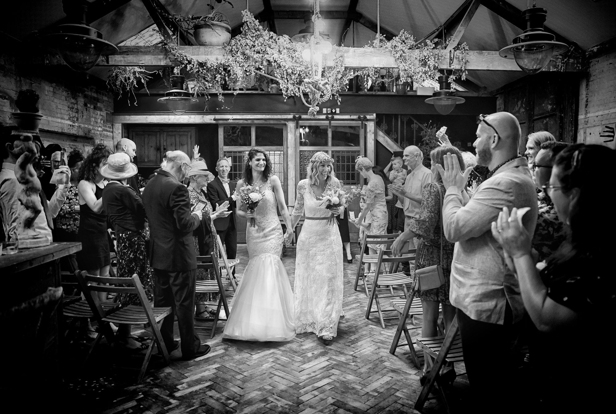 Wedding recessional at Clapton Country Club London two brides