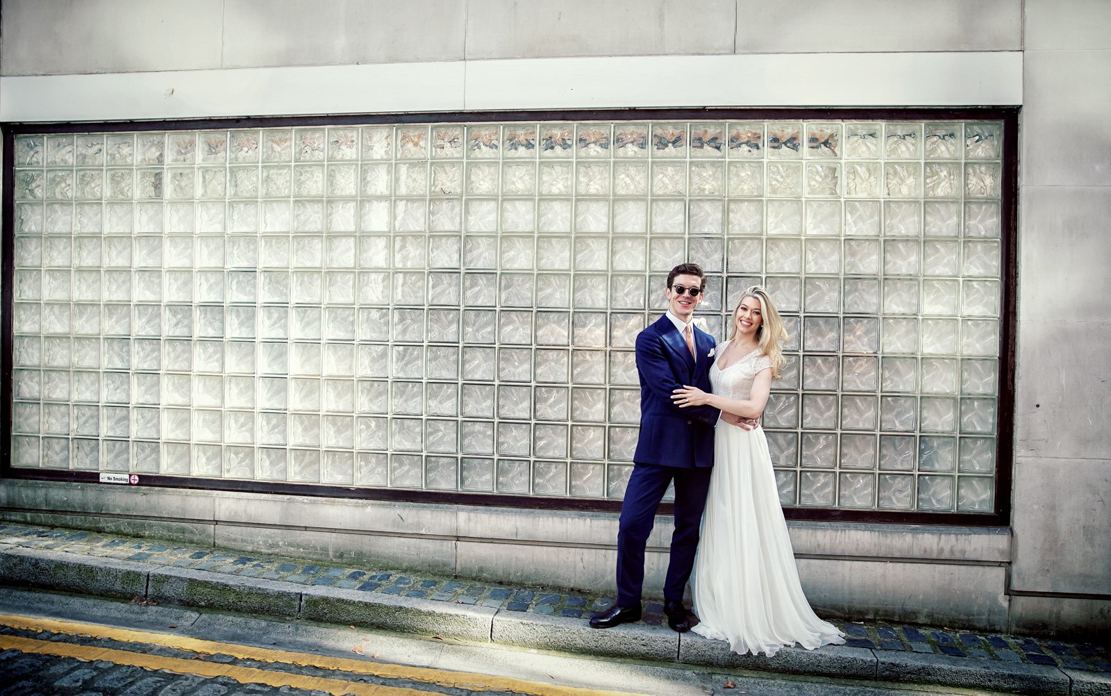 Islington wedding couple in front of glass wall image