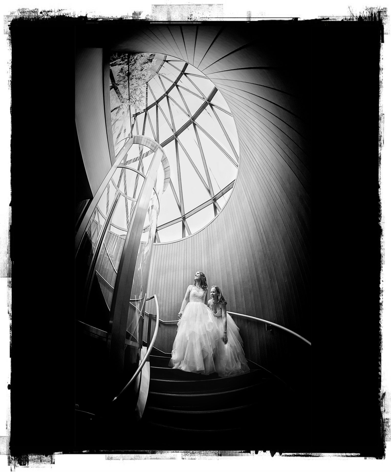 Gherkin wedding day two brides on stairs