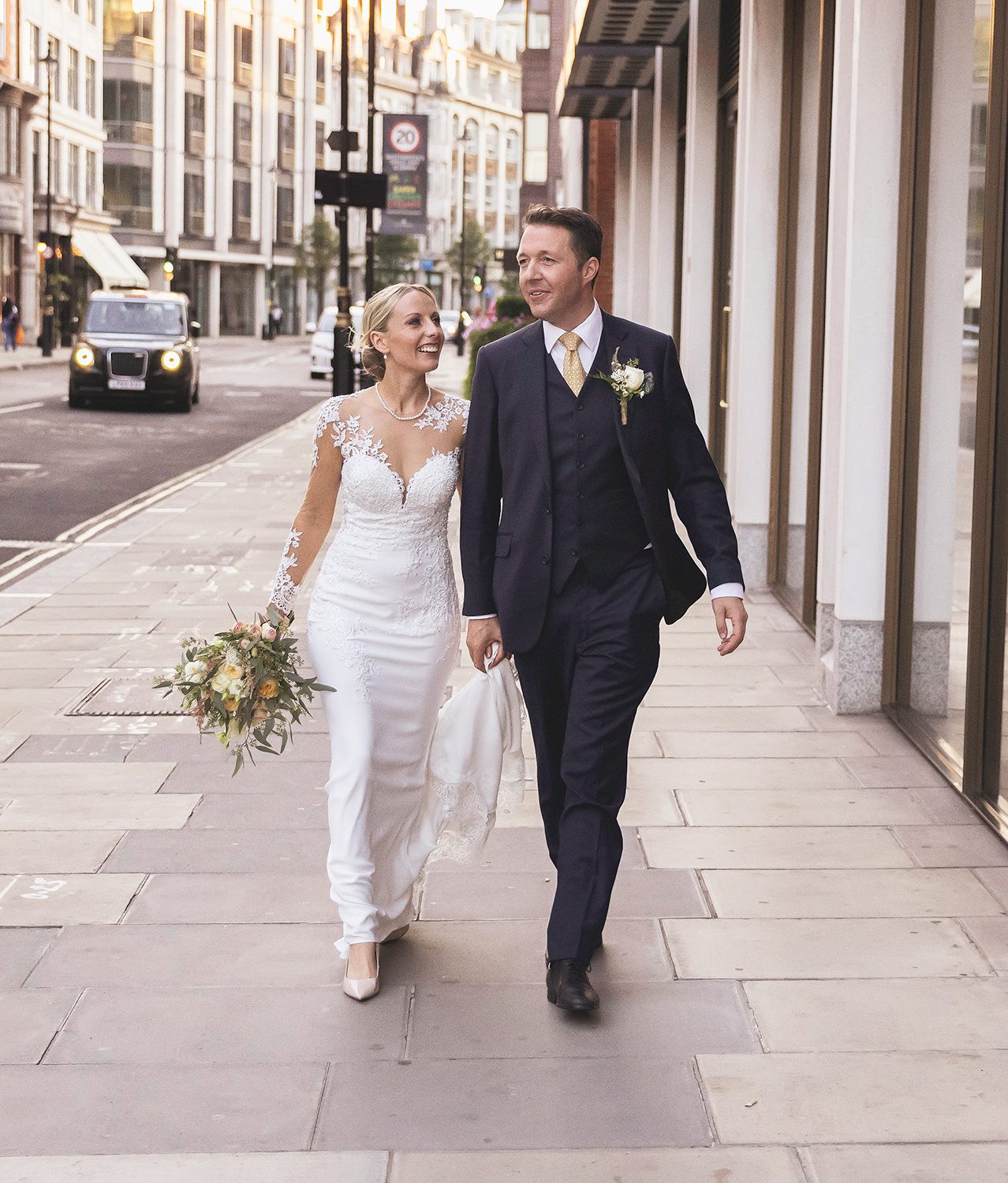 Wedding couple walk through Westminster London