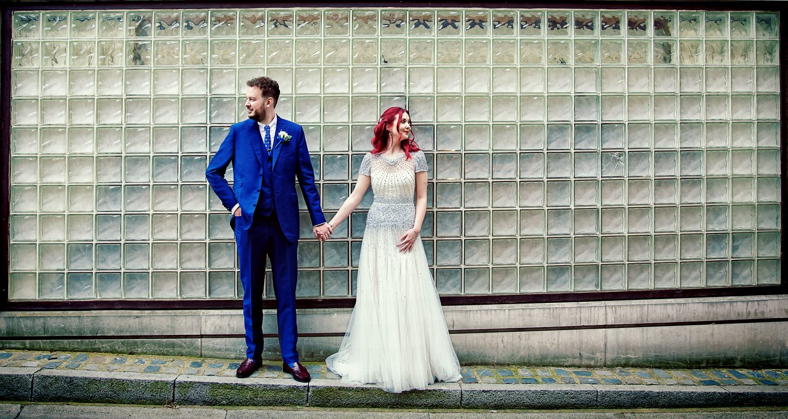 Islington wedding bride and groom by glass wall London