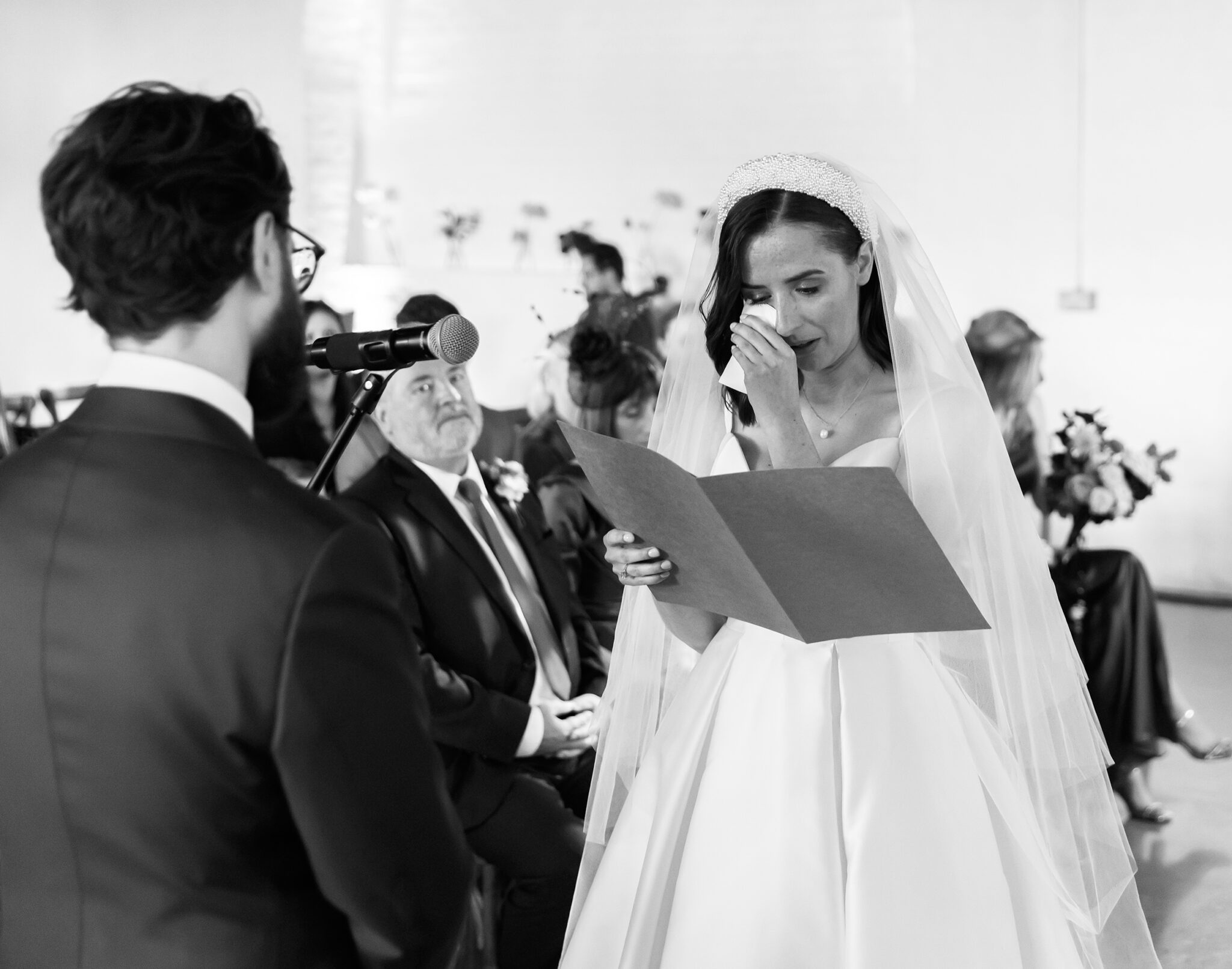 Bride cries reading vows Trinity Buoy Wharf wedding ceremony