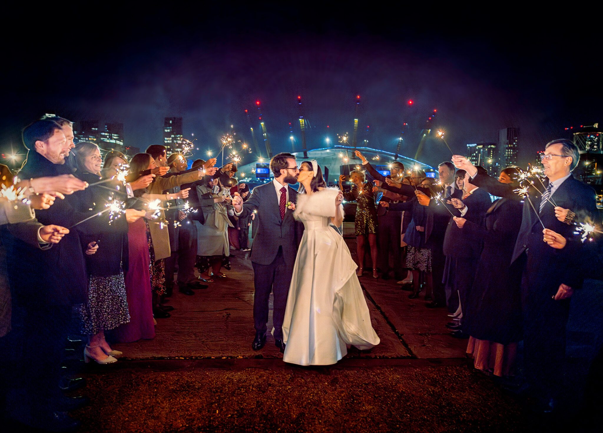 Trinity Buoy Wharf Wedding sparklers shot with bride and groom and O2 in background 1