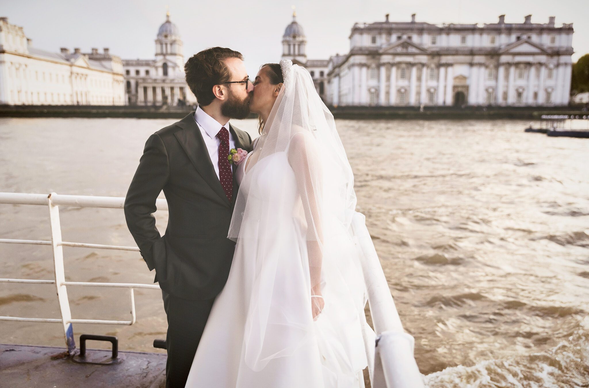 Trinity Buoy Wharf Wedding couple kiss on Thames cruise