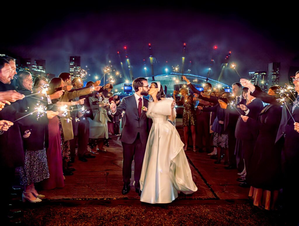 Trinity Buoy Wharf wedding sparklers with bride and groom kiss